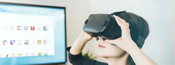 woman using VR headset attached to windows PC